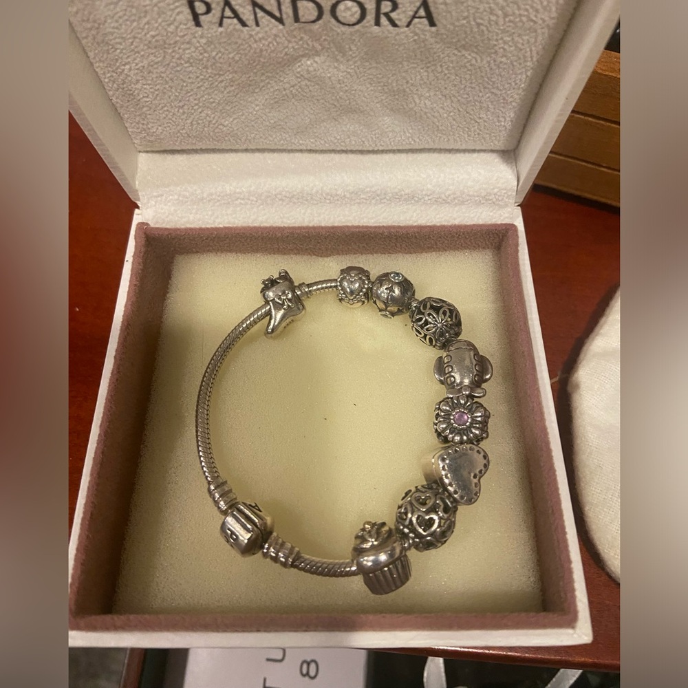 2 Pandora bracelets  with 12 charms included.
